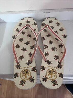 Tory Burch Cream Floral Logo Flip Flops with Pink Straps